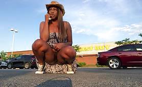 Hot ebony girlfriend needs to pee so badly that instead of waiting too much for her man she goes into the parking lot and pees near a car while flashing her ass