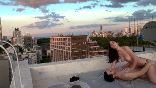 This kinky brunette babe rides and sucks her boyfriend's cock on the roof. This sexy brunette babe gets her pussy filled with cum on the roof.